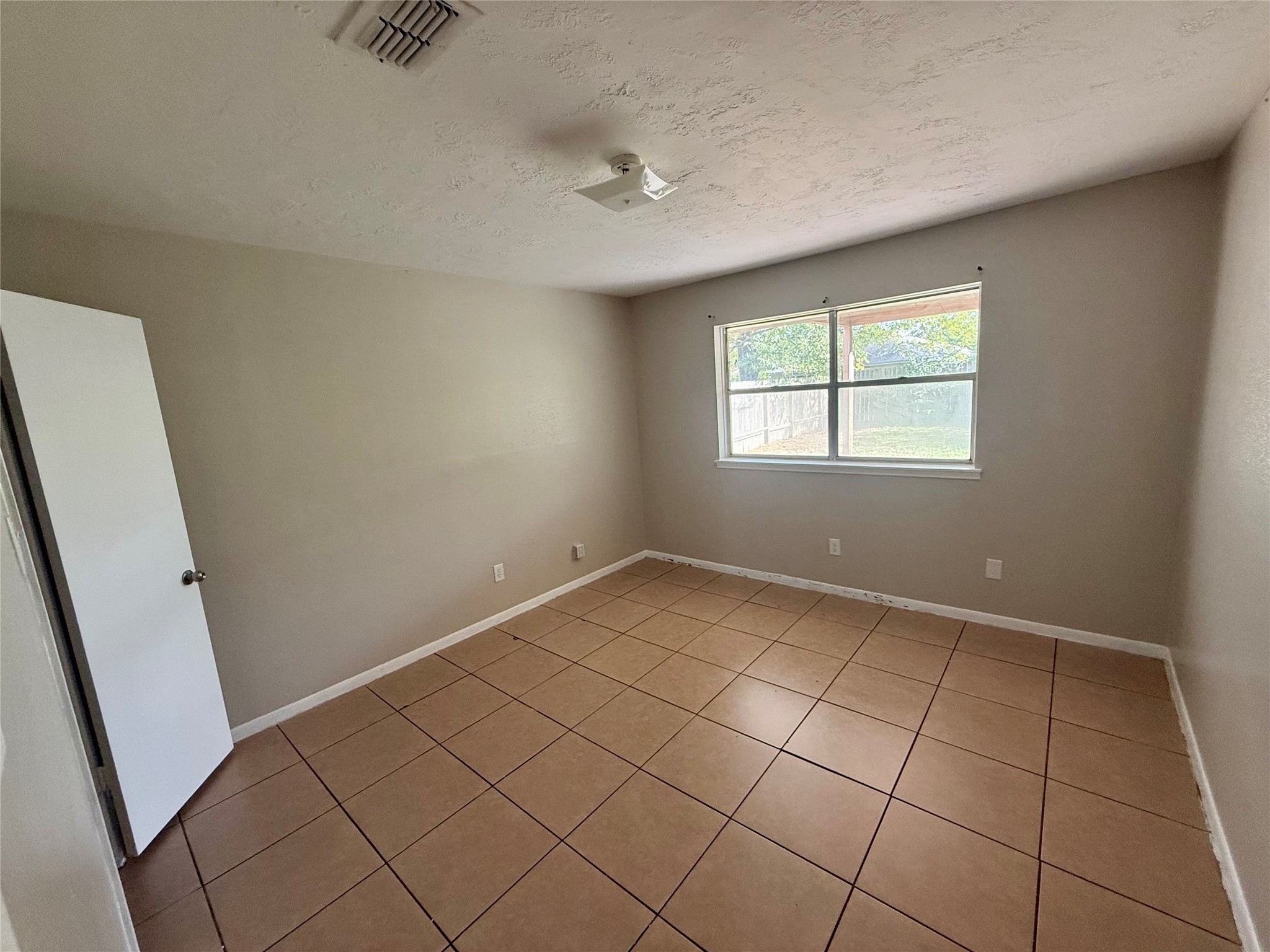 3211 Hartfield Lane Spring, TX 77388 - Photo 17 of 23 an empty room with windows