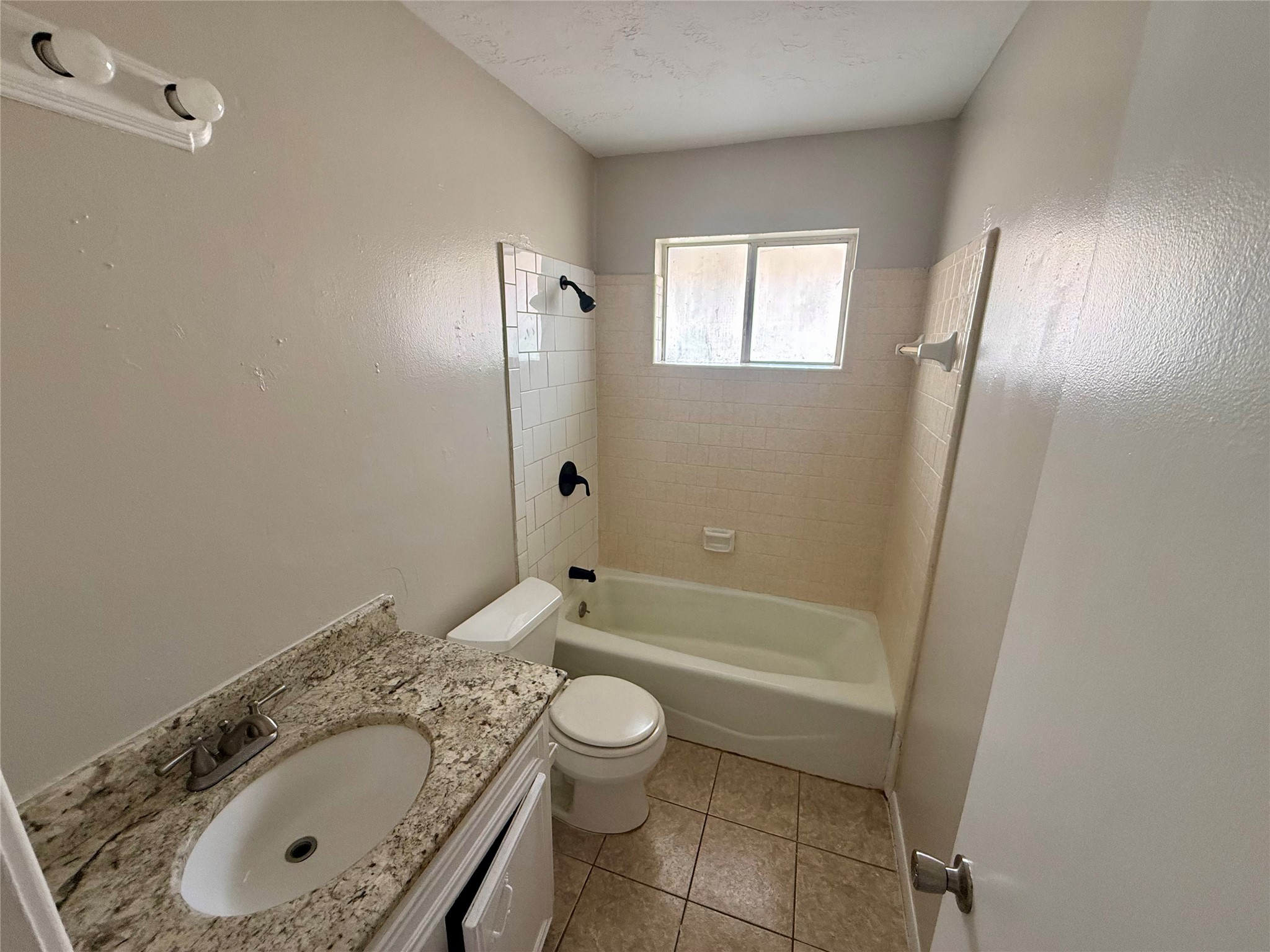 3211 Hartfield Lane Spring, TX 77388 - Photo 18 of 23 a bathroom with a granite countertop sink toilet and shower