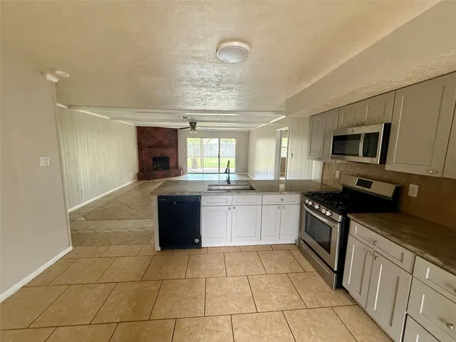 a large kitchen with cabinets