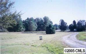 2507 Medlin Road Monroe, NC 28112 - Photo 2 of 3 a view of a yard with trees in the background