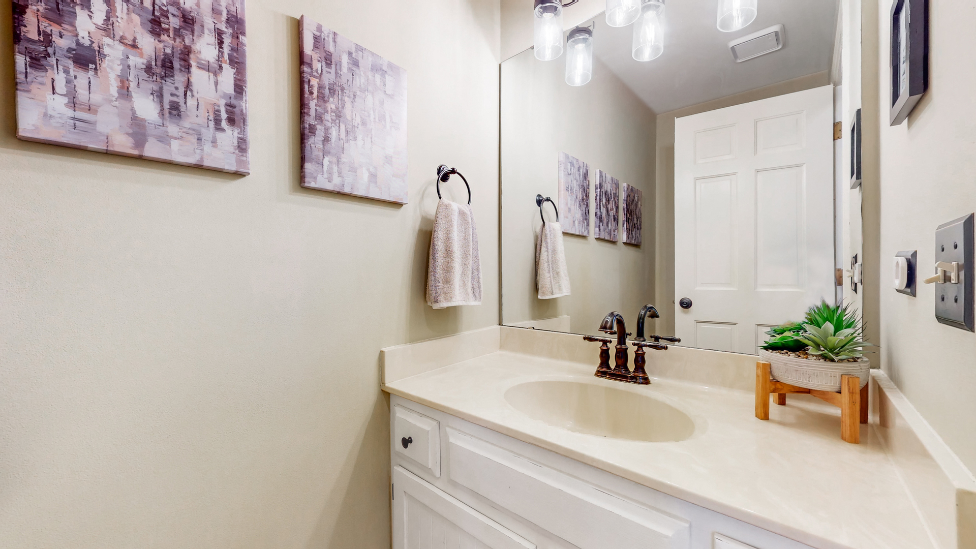 821 South River Road Naperville, IL 60540 - Photo 13 of 32 a bathroom with a sink and a mirror