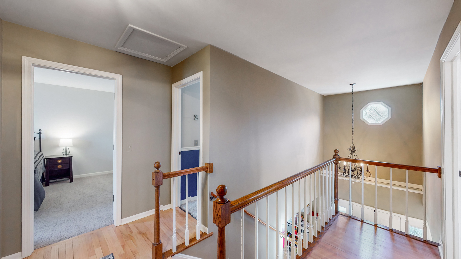 821 South River Road Naperville, IL 60540 - Photo 16 of 32 a view of a hallway with wooden floor and stairs