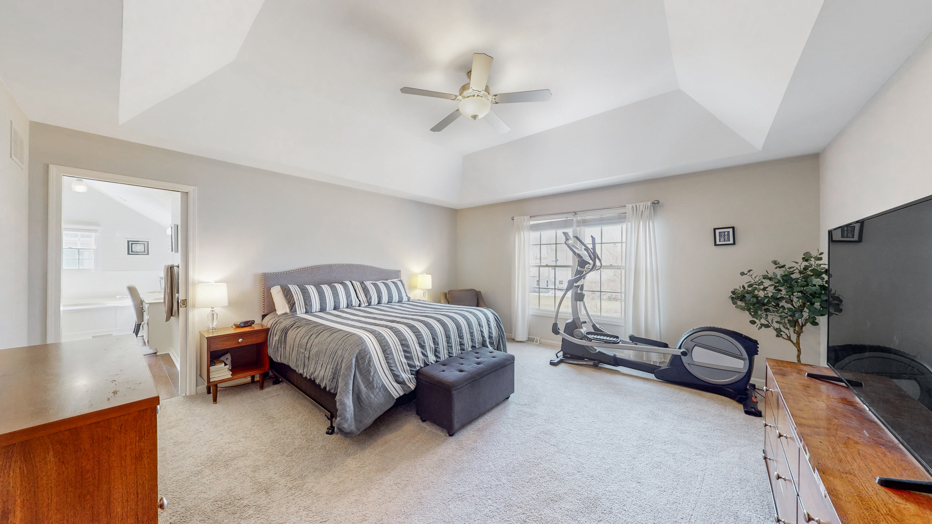 821 South River Road Naperville, IL 60540 - Photo 17 of 32 a spacious bedroom with a bed and a window
