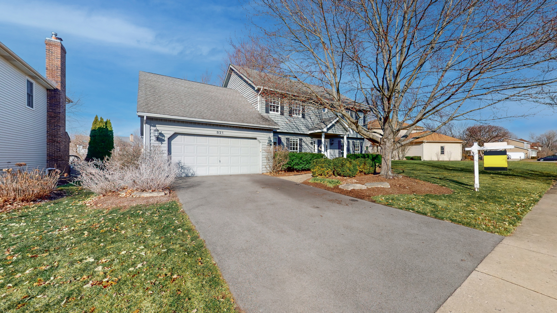821 South River Road Naperville, IL 60540 - Photo 2 of 32 a front view of a house with garden