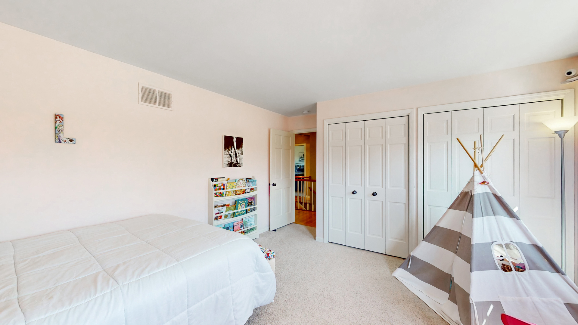 821 South River Road Naperville, IL 60540 - Photo 22 of 32 a bedroom with a bed and a window
