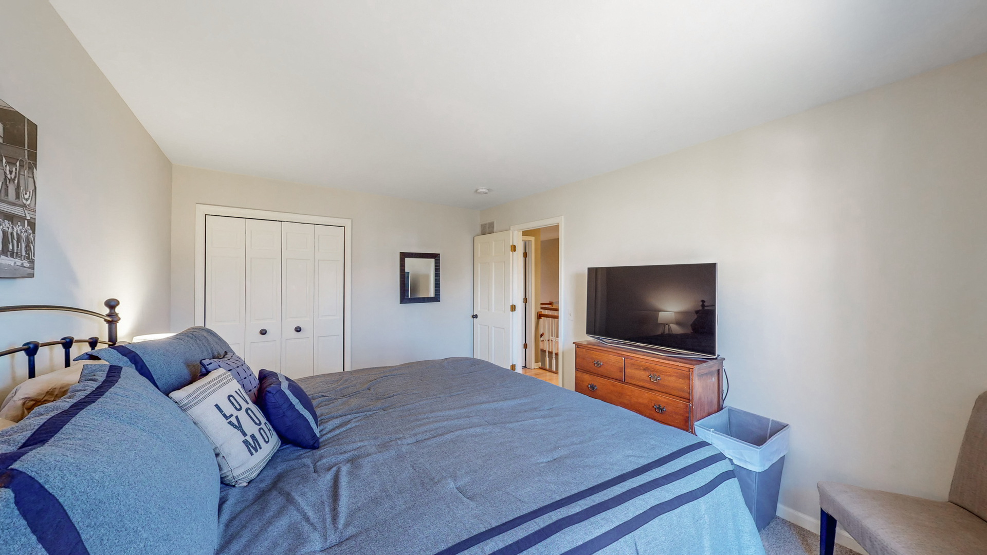 821 South River Road Naperville, IL 60540 - Photo 26 of 32 a bedroom with a bed and a flat screen tv