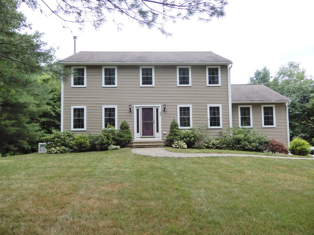 82 Town Farm Road Brookfield, MA 01506 - Photo 1 of 28 a front view of a house with yard and green space