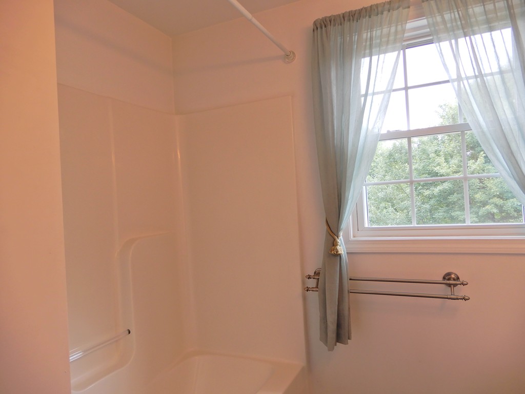 82 Town Farm Road Brookfield, MA 01506 - Photo 24 of 28 a bathroom with a window and a shower