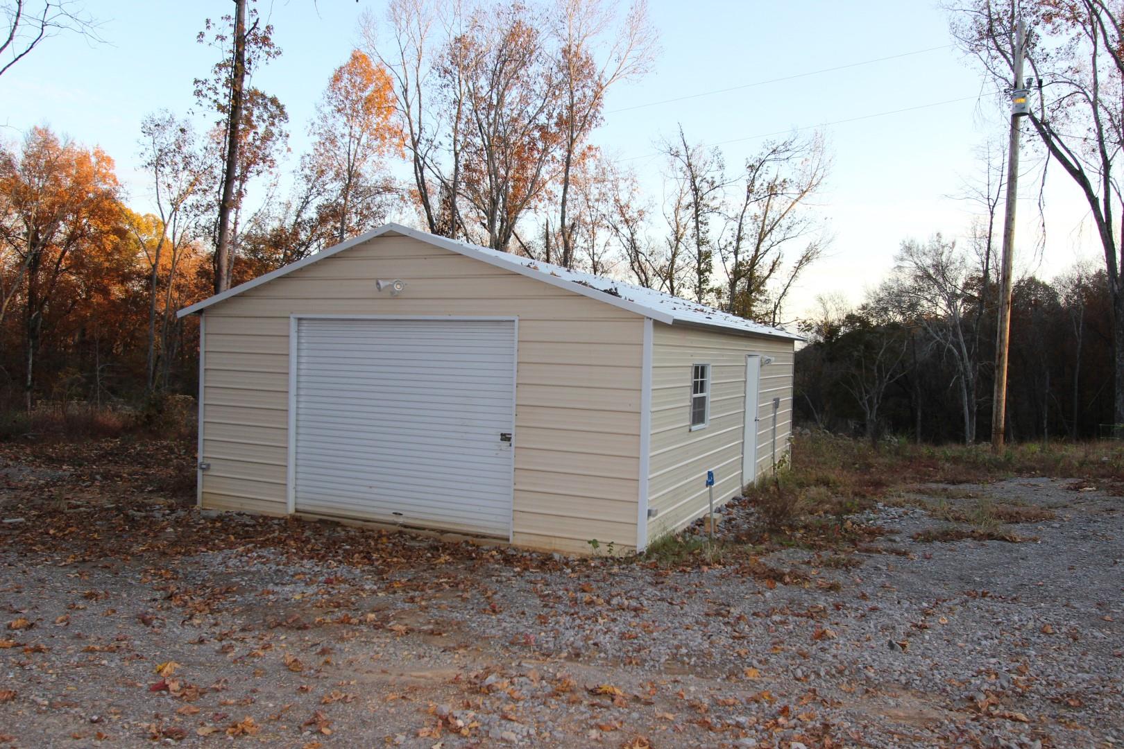 182 River Road Dover, TN 37058 - Photo 2 of 30 20 x 30 metal detached garage w/ electric