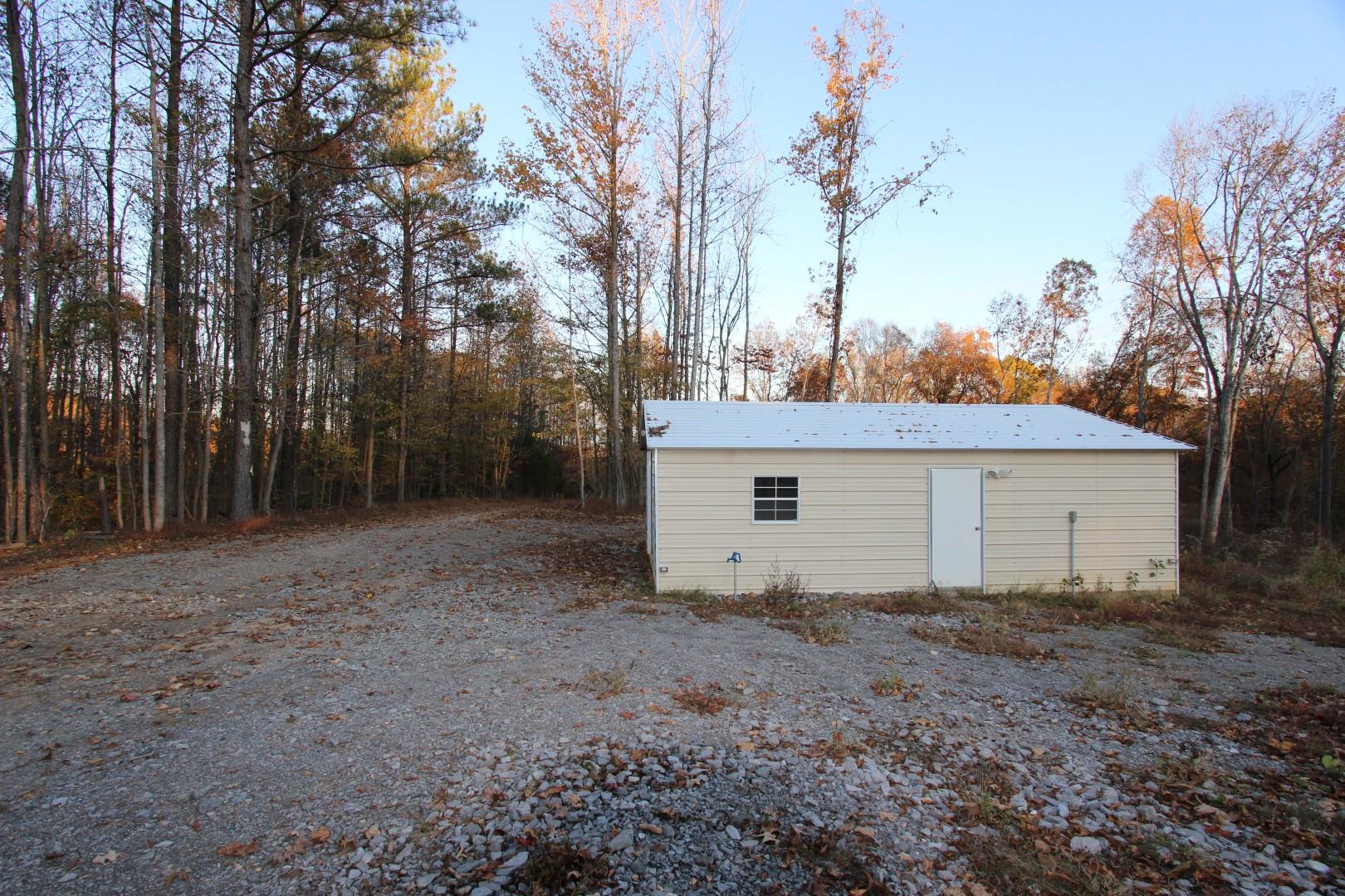 182 River Road Dover, TN 37058 - Photo 3 of 30 Concrete floor, side door access.