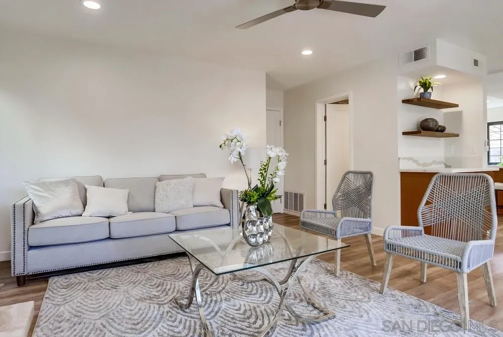 916 Alyssum Road Carlsbad, CA 92011 - Photo 12 of 42 a living room with furniture potted plant and a chandelier