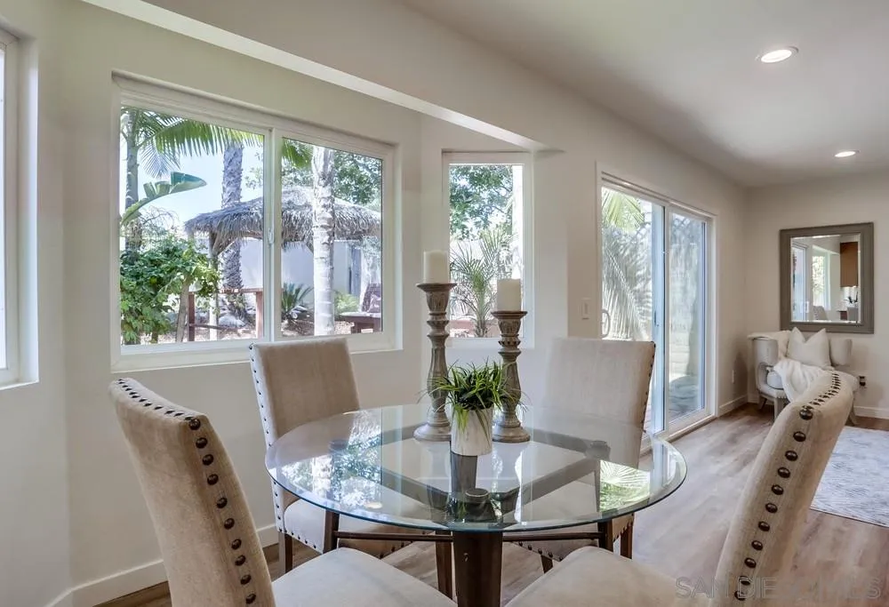 916 Alyssum Road Carlsbad, CA 92011 - Photo 15 of 42 a view of a dining room with furniture window and wooden floor