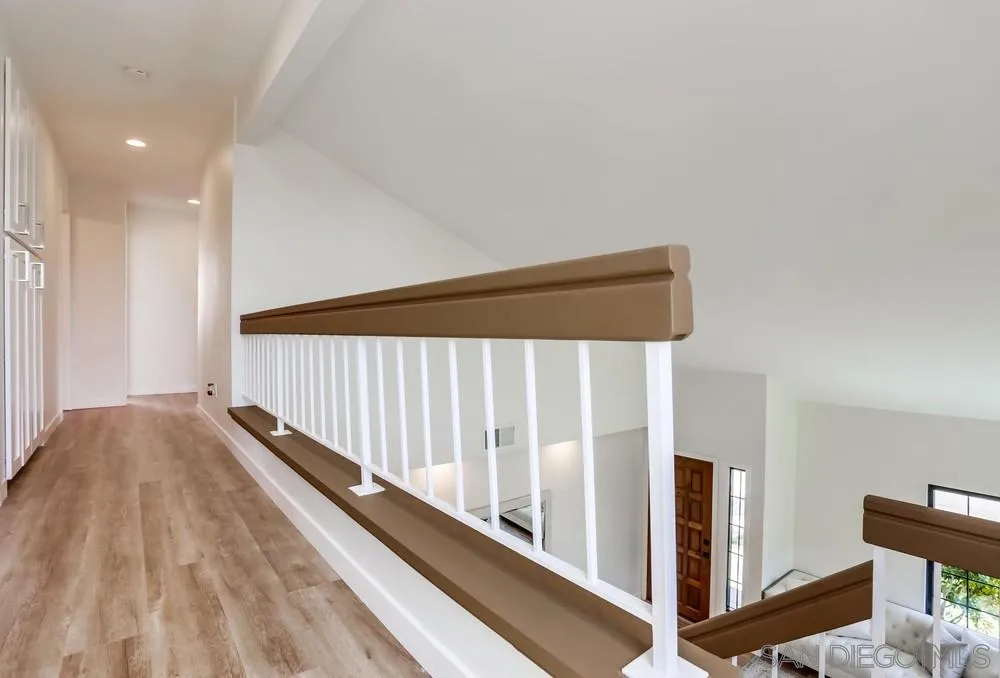 916 Alyssum Road Carlsbad, CA 92011 - Photo 21 of 42 a view of a hallway with staircase