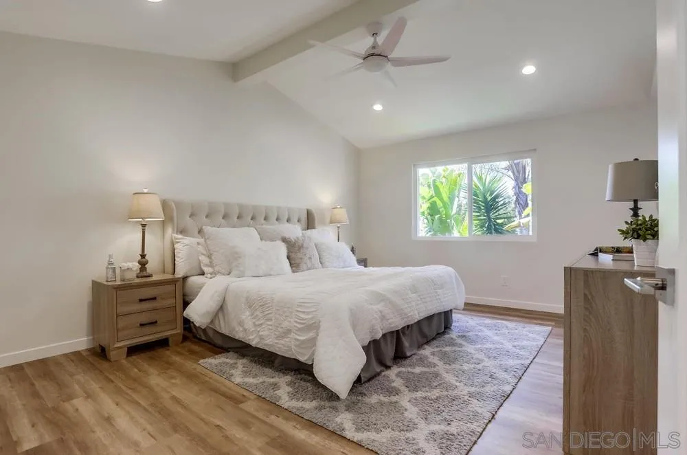 916 Alyssum Road Carlsbad, CA 92011 - Photo 22 of 42 a bedroom with a bed and window