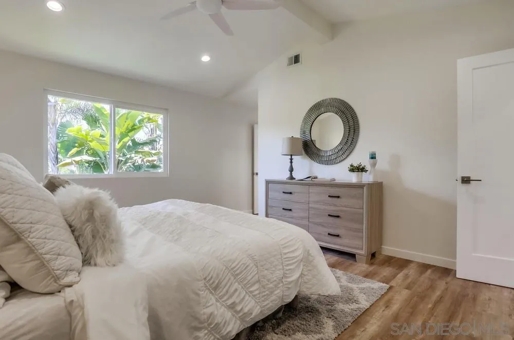 916 Alyssum Road Carlsbad, CA 92011 - Photo 23 of 42 a bedroom with a bed and a large window