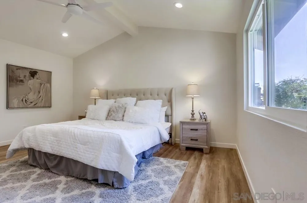 916 Alyssum Road Carlsbad, CA 92011 - Photo 25 of 42 a bed room with a bed and window