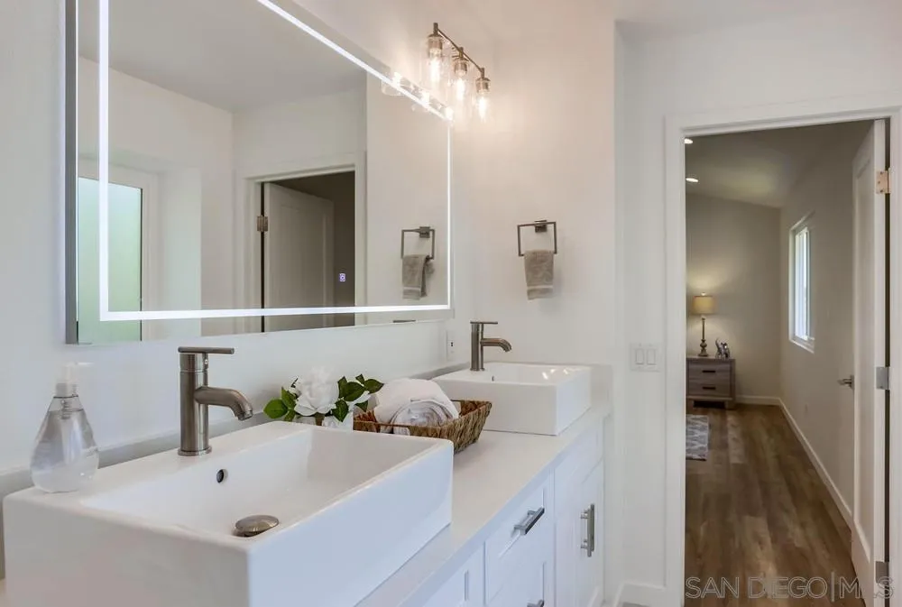916 Alyssum Road Carlsbad, CA 92011 - Photo 28 of 42 a bathroom with a sink and a mirror