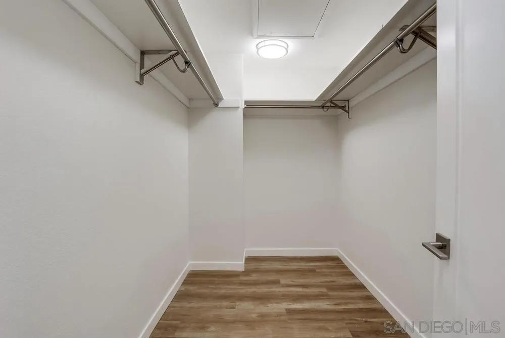 916 Alyssum Road Carlsbad, CA 92011 - Photo 29 of 42 a view of a room with racks on the wall
