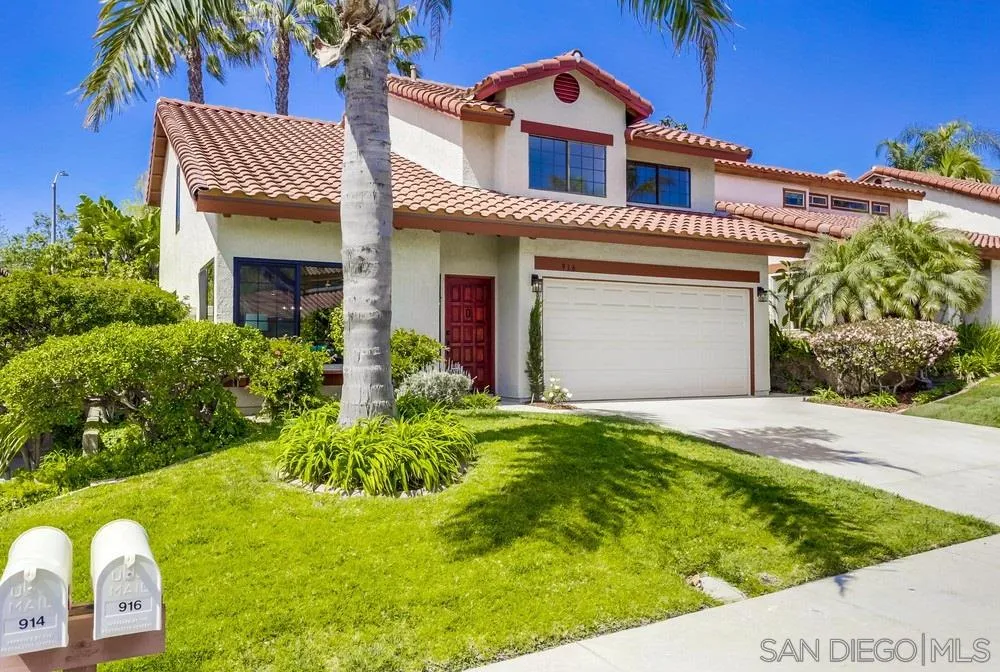 916 Alyssum Road Carlsbad, CA 92011 - Photo 3 of 42 a front view of a house with a yard
