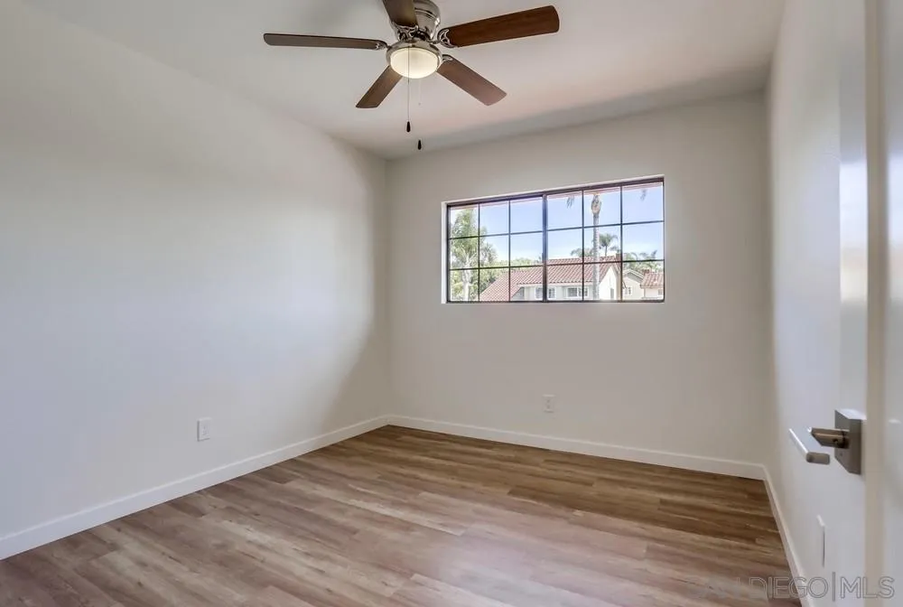 916 Alyssum Road Carlsbad, CA 92011 - Photo 32 of 42 wooden floor in an empty room with a window