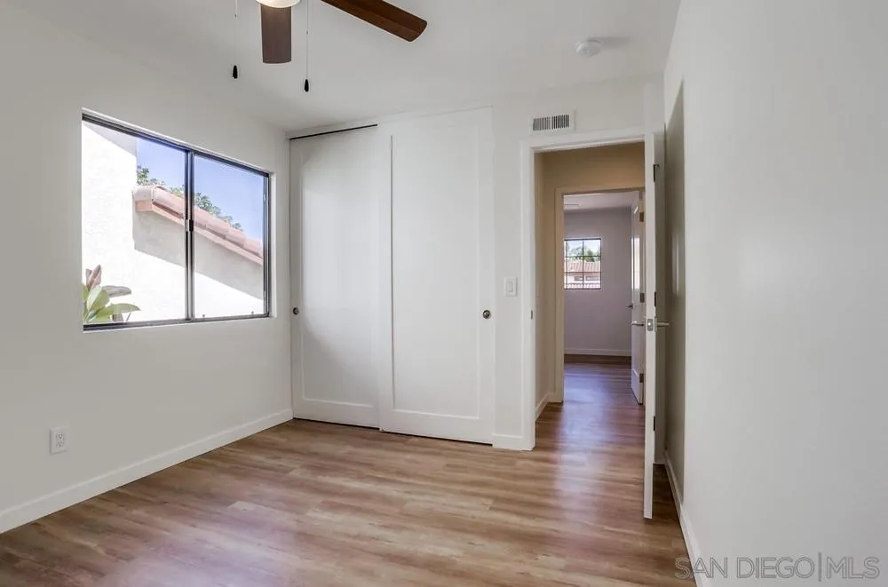 916 Alyssum Road Carlsbad, CA 92011 - Photo 35 of 42 wooden floor in an empty room with a window