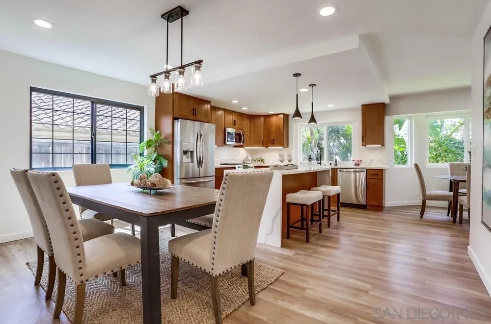 916 Alyssum Road Carlsbad, CA 92011 - Photo 8 of 42 a view of a dining room with furniture window and wooden floor