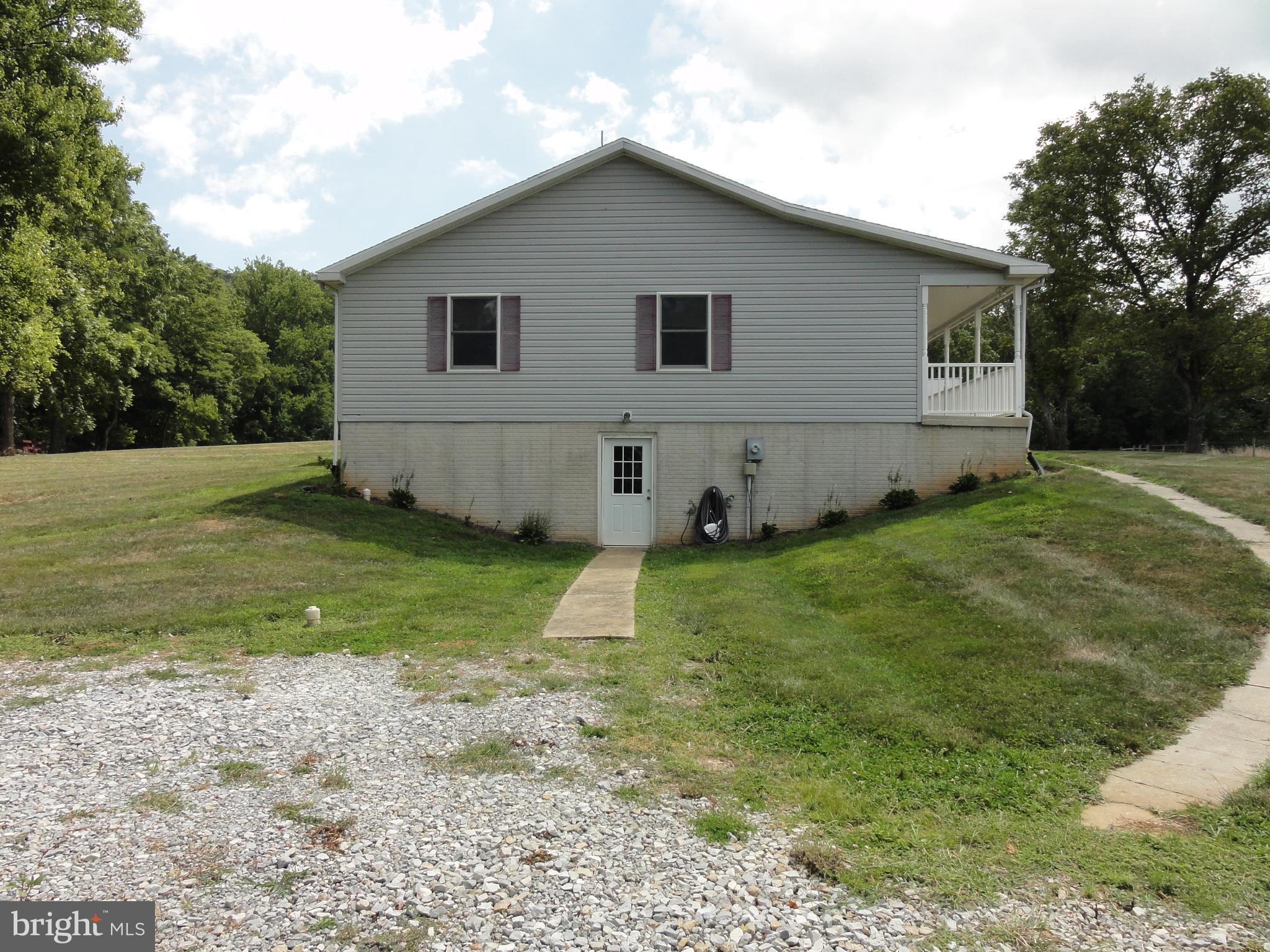 13230 White Rock Road Purcellville, VA 20132 - Photo 13 of 13 a view of a backyard with plants and large tree