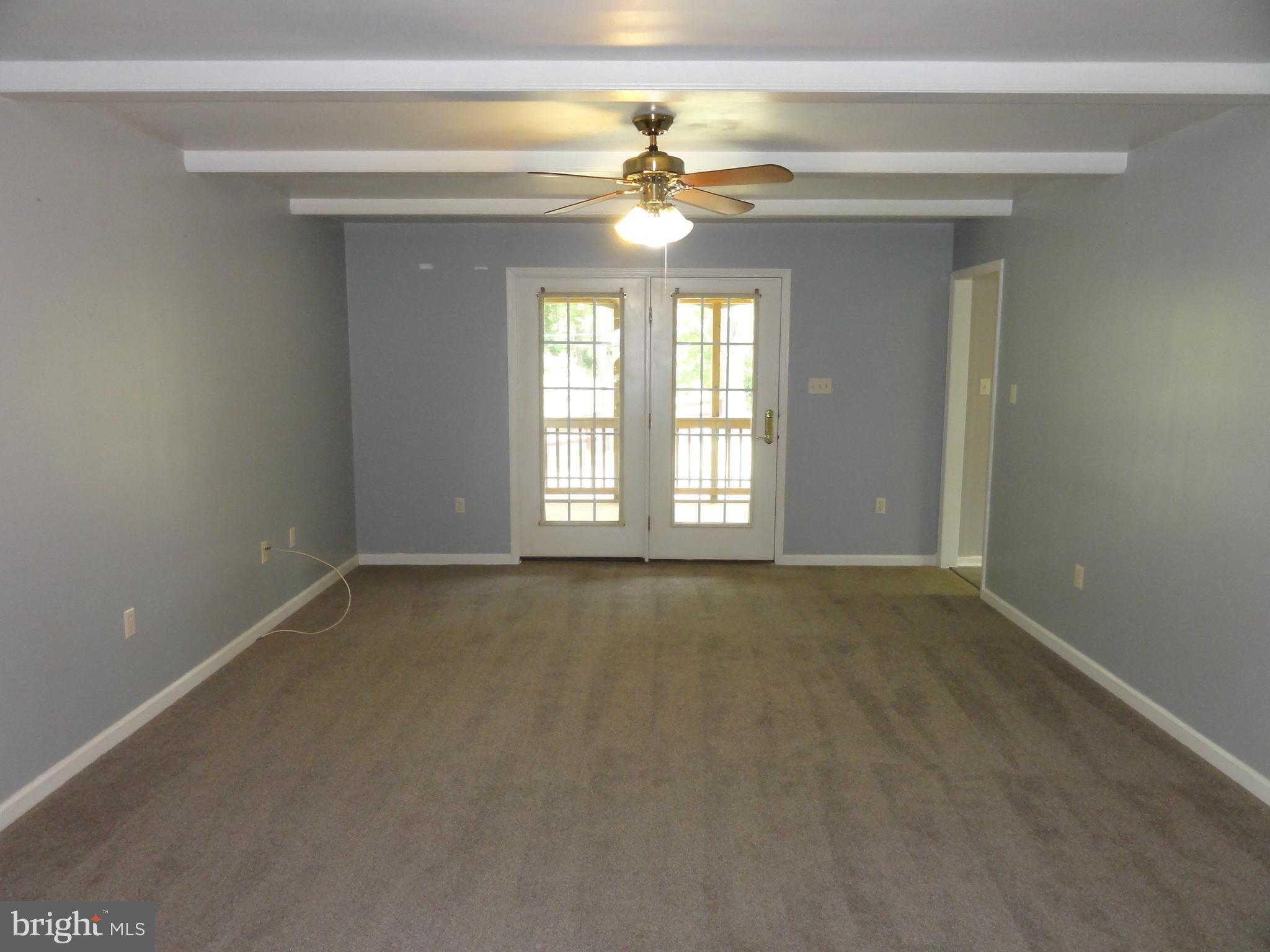 13230 White Rock Road Purcellville, VA 20132 - Photo 6 of 13 a view of an empty room with a window