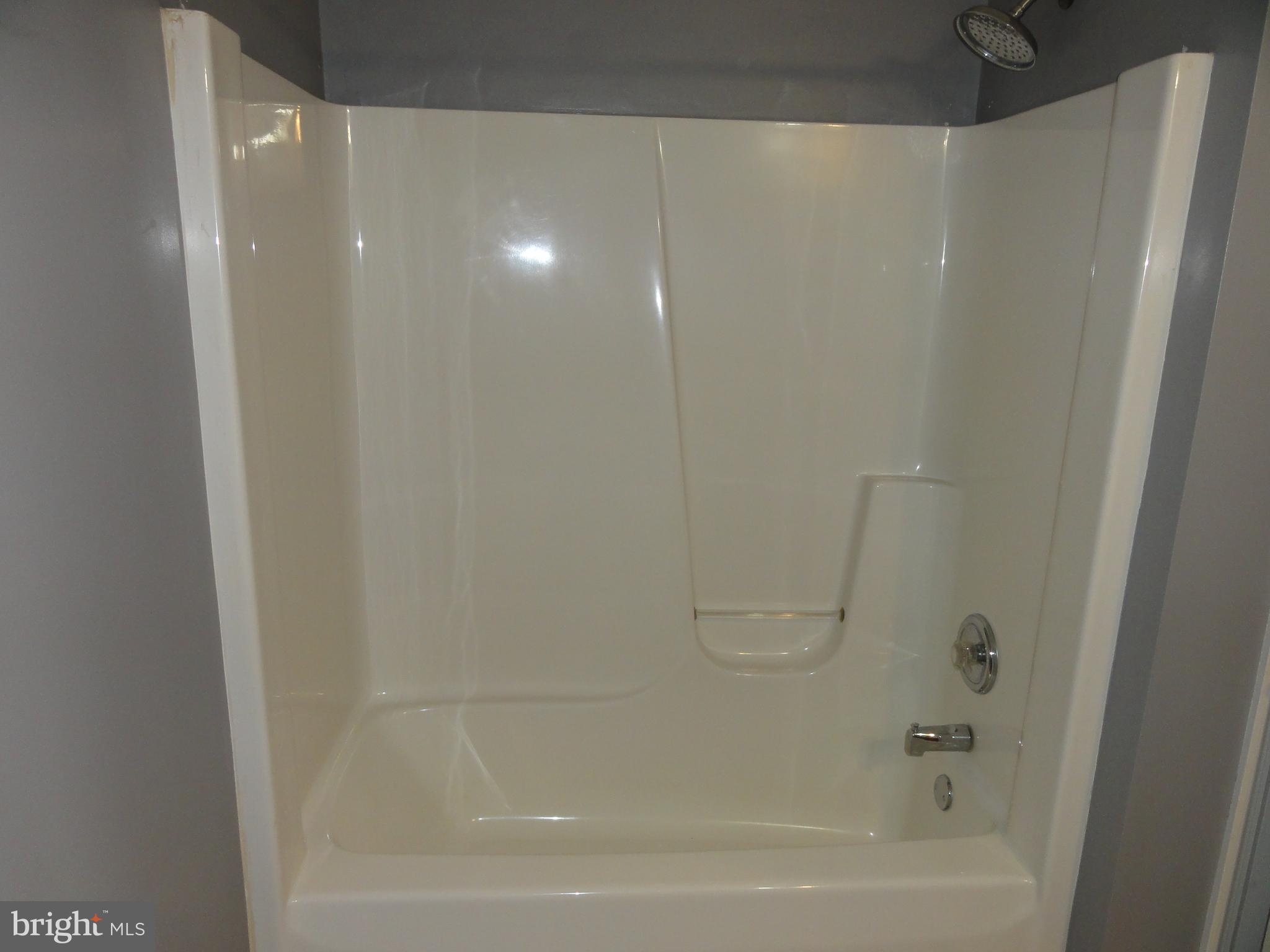 13230 White Rock Road Purcellville, VA 20132 - Photo 9 of 13 a close view of a bathtub in bathroom