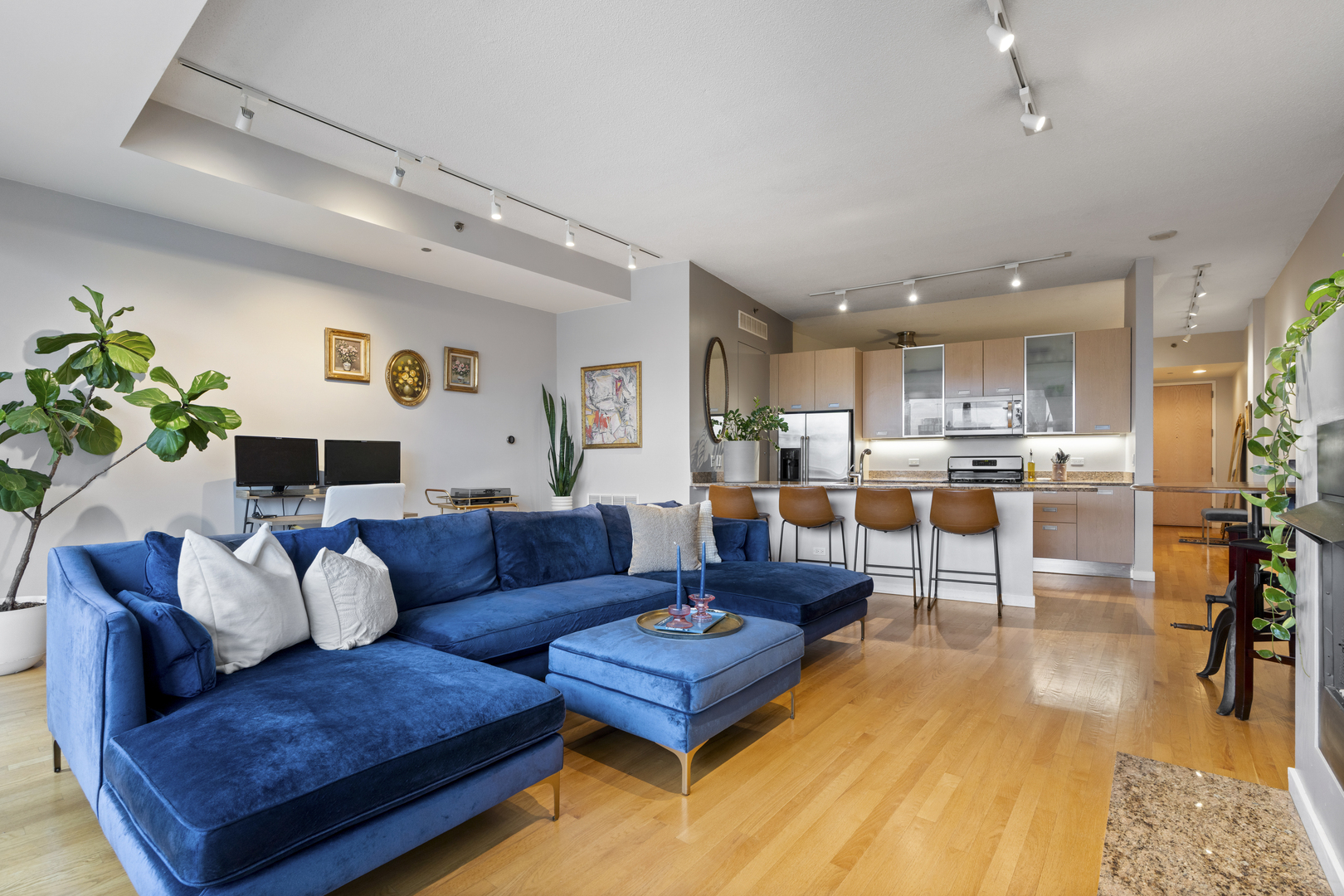 950 West Erie Street, Unit 602 Chicago, IL 60642 - Photo 11 of 18 a living room with furniture and kitchen view