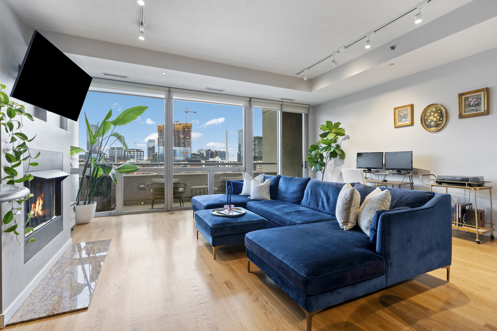 950 West Erie Street, Unit 602 Chicago, IL 60642 - Photo 6 of 18 a living room with furniture and a flat screen tv