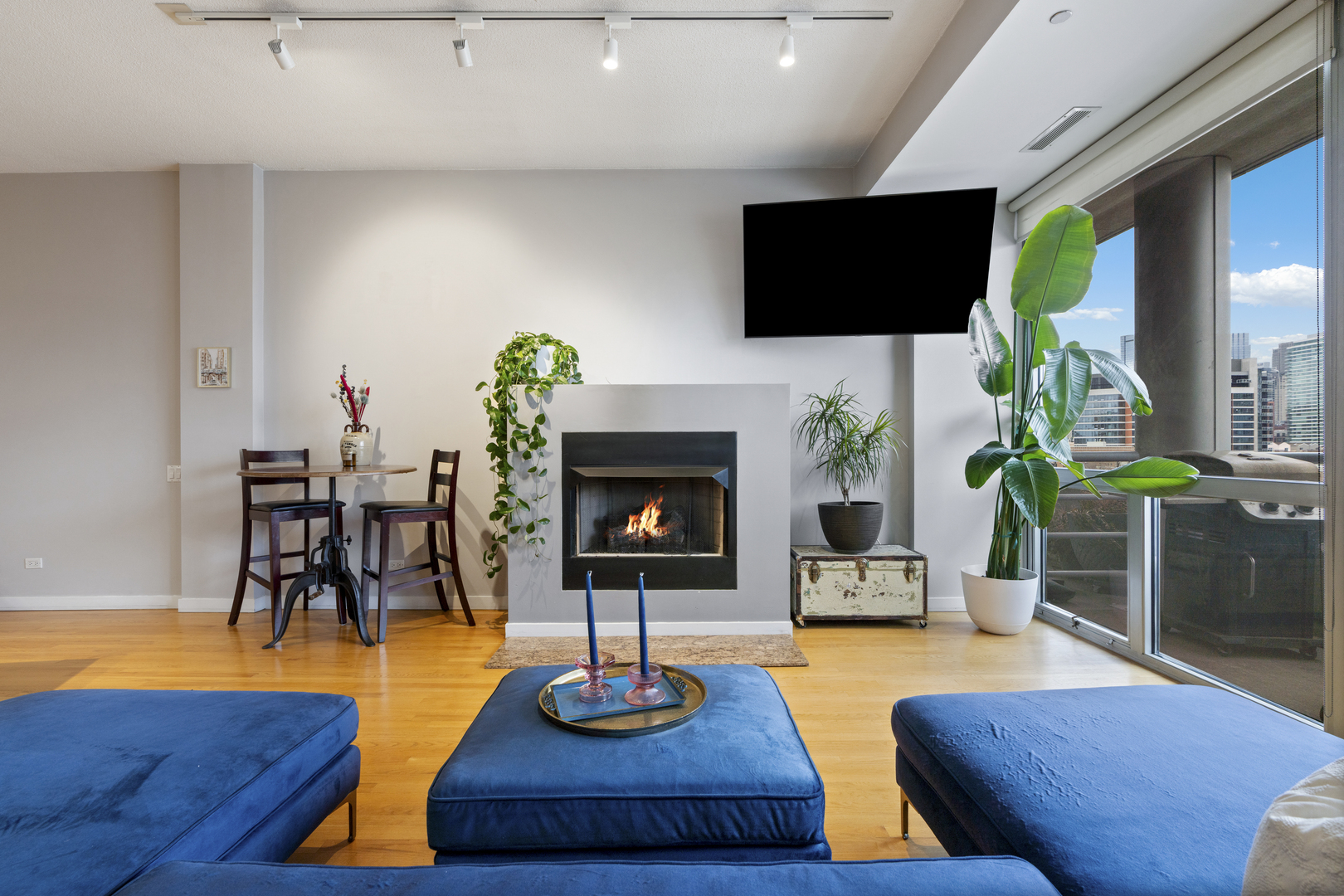 950 West Erie Street, Unit 602 Chicago, IL 60642 - Photo 9 of 18 a living room with furniture fireplace and flat screen tv