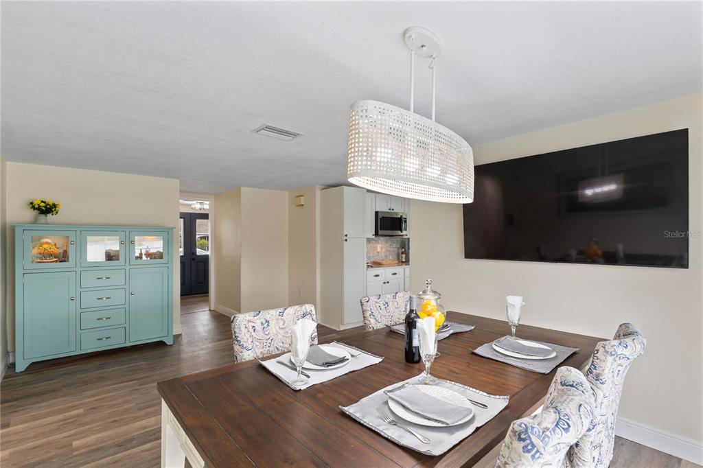 3409 Springfield Drive Holiday, FL 34691 - Photo 11 of 37 a living room with furniture and a flat screen tv