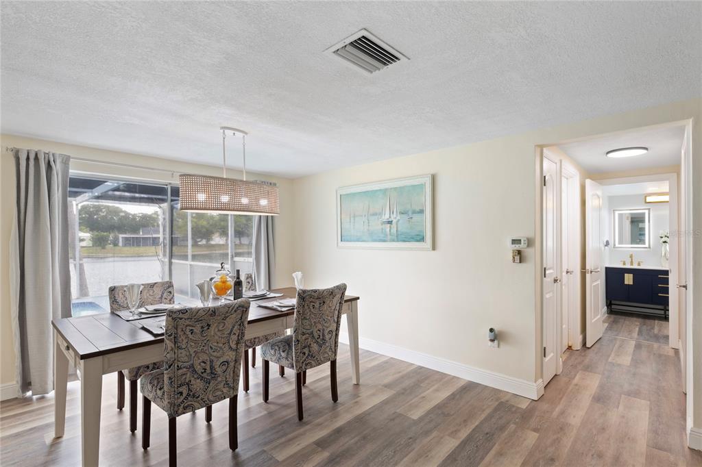 3409 Springfield Drive Holiday, FL 34691 - Photo 13 of 37 a view of a dining room with furniture window and wooden floor