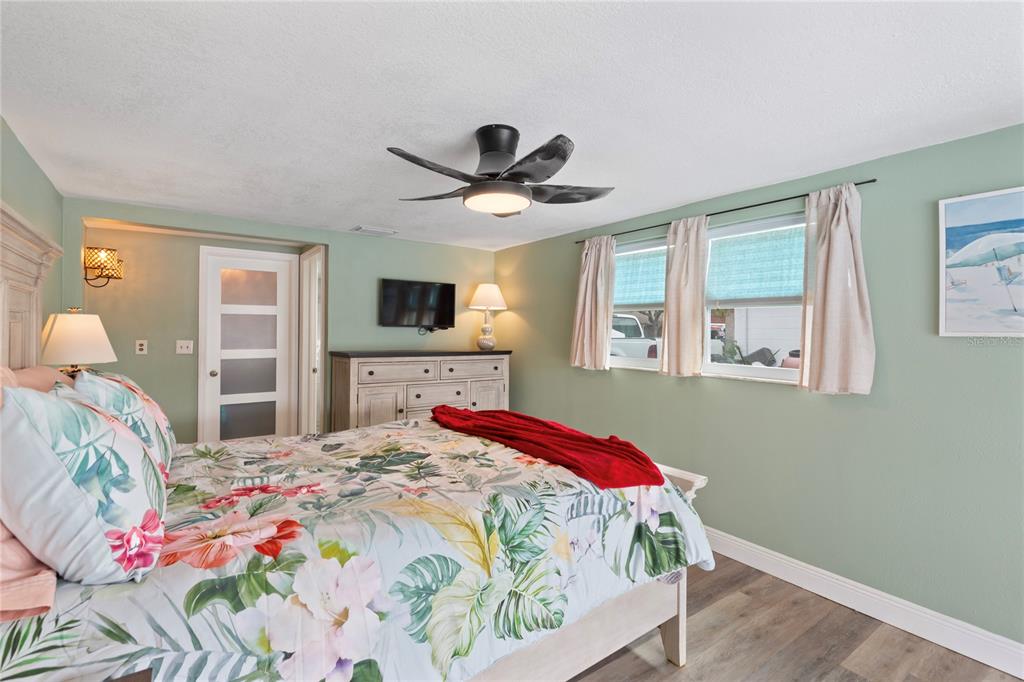 3409 Springfield Drive Holiday, FL 34691 - Photo 14 of 37 a bedroom with a bed and a chandelier