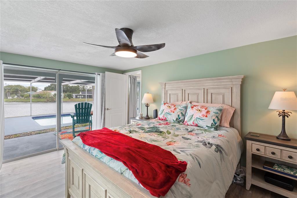 3409 Springfield Drive Holiday, FL 34691 - Photo 15 of 37 a bedroom with a large bed and a large window