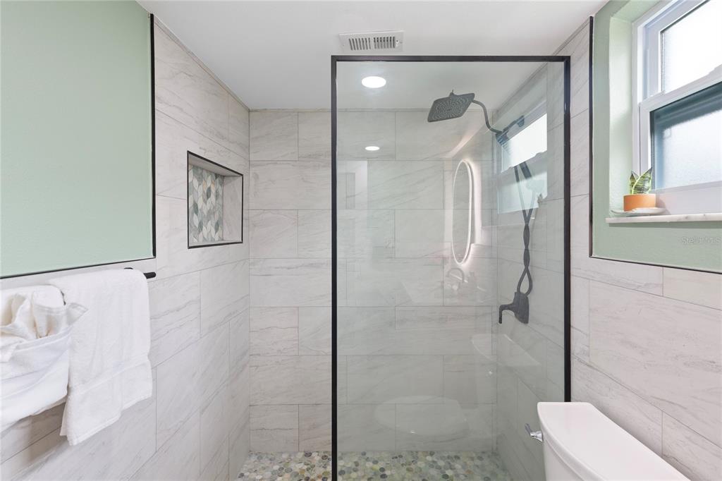 3409 Springfield Drive Holiday, FL 34691 - Photo 19 of 37 a bathroom with a shower and toilet