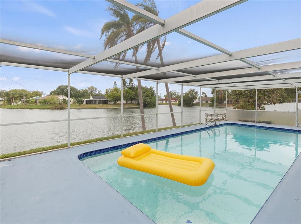 3409 Springfield Drive Holiday, FL 34691 - Photo 20 of 37 a view of a swimming pool with an outdoor seating