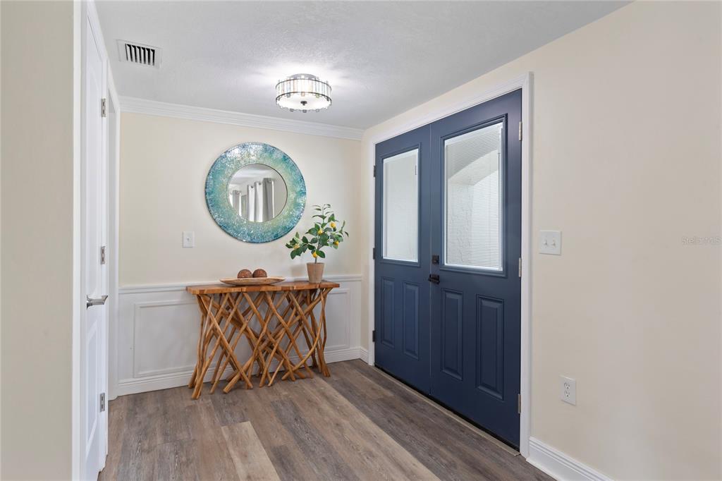 3409 Springfield Drive Holiday, FL 34691 - Photo 2 of 37 a view of a hallway with wooden floor