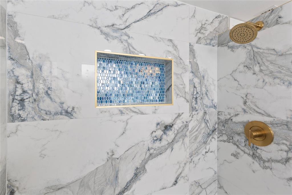 3409 Springfield Drive Holiday, FL 34691 - Photo 22 of 37 a bathroom with a bathtub and shower