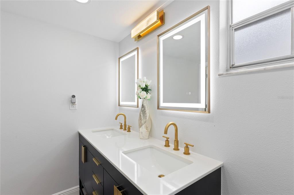 3409 Springfield Drive Holiday, FL 34691 - Photo 23 of 37 a bathroom with a sink and a mirror