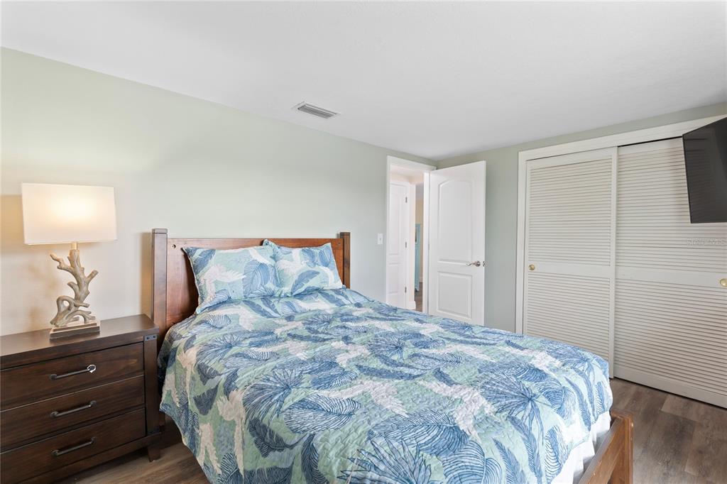 3409 Springfield Drive Holiday, FL 34691 - Photo 25 of 37 a bedroom with a bed and a night stand