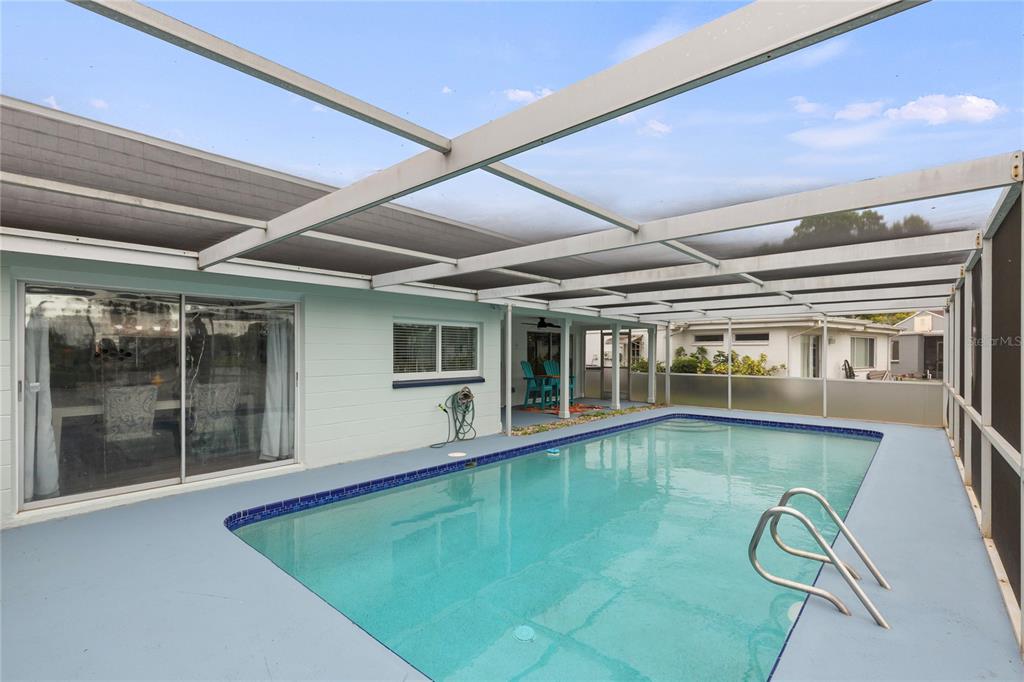 3409 Springfield Drive Holiday, FL 34691 - Photo 31 of 37 a indoor swimming pool in middle of the house