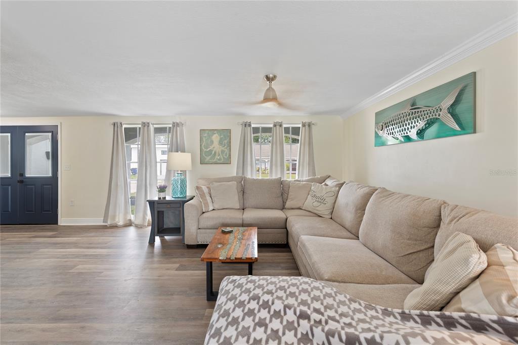 3409 Springfield Drive Holiday, FL 34691 - Photo 4 of 37 a living room with furniture or couch and a wooden floor
