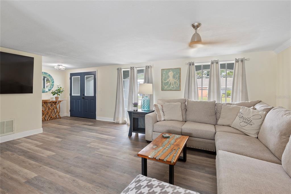 3409 Springfield Drive Holiday, FL 34691 - Photo 5 of 37 a living room with furniture and a flat screen tv