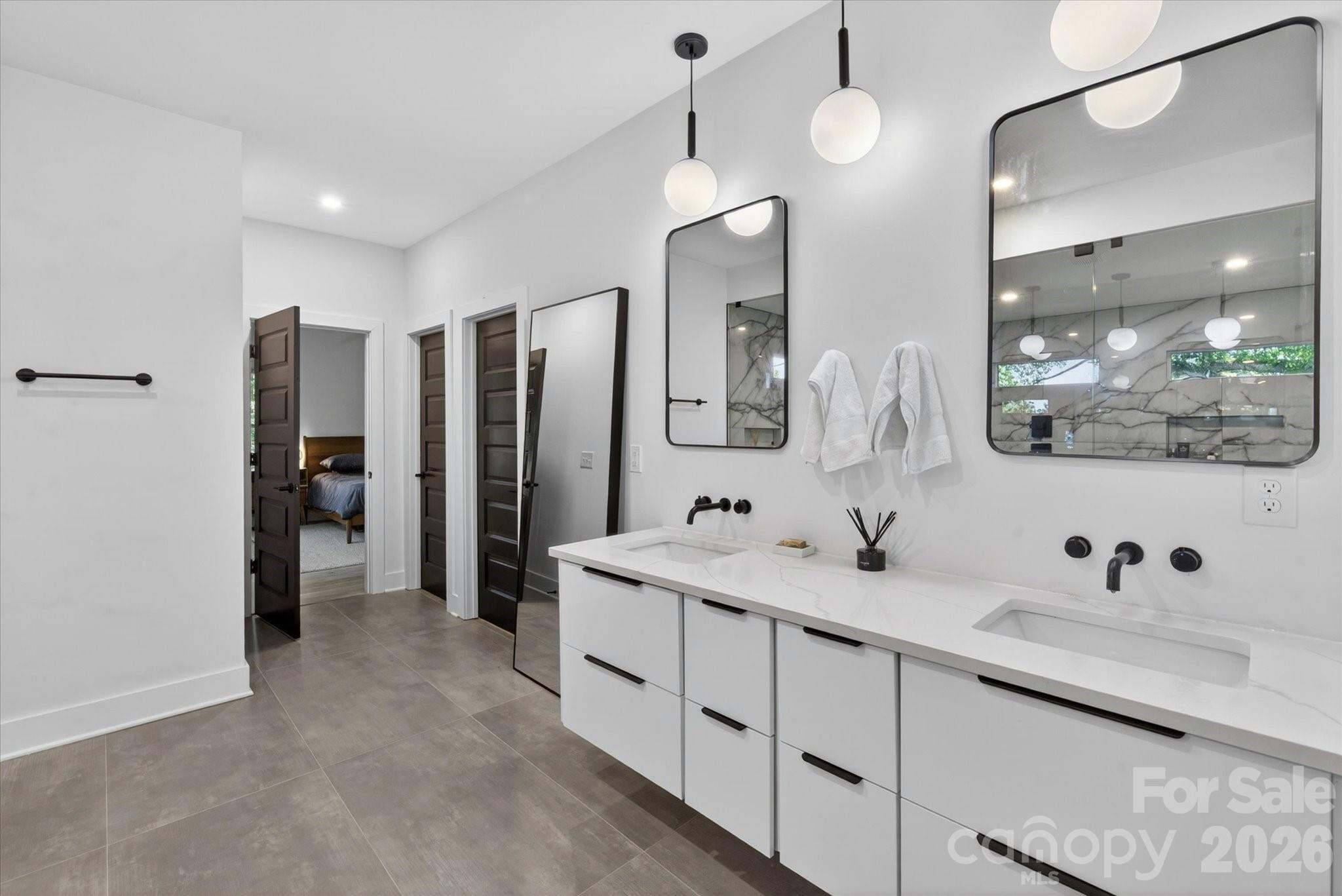 1608 Chippendale Road Charlotte, NC 28205 - Photo 37 of 46 a bathroom with a double vanity sink mirror and double