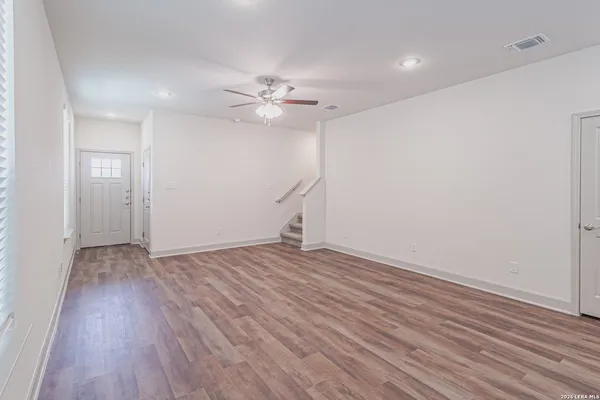 a view of cabinets and wooden floor