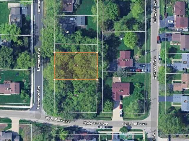 an aerial view of residential houses with outdoor space and street view