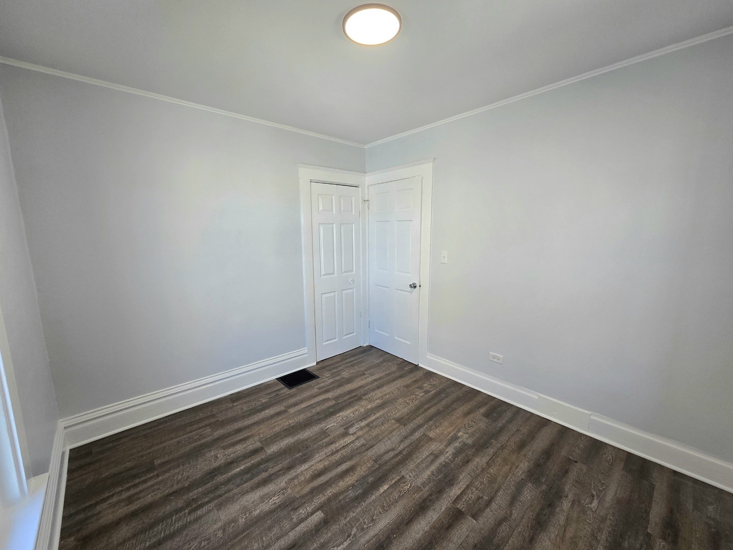 328 Rosewood Avenue Aurora, IL 60505 - Photo 12 of 24 a view of room with wooden floor and white walls