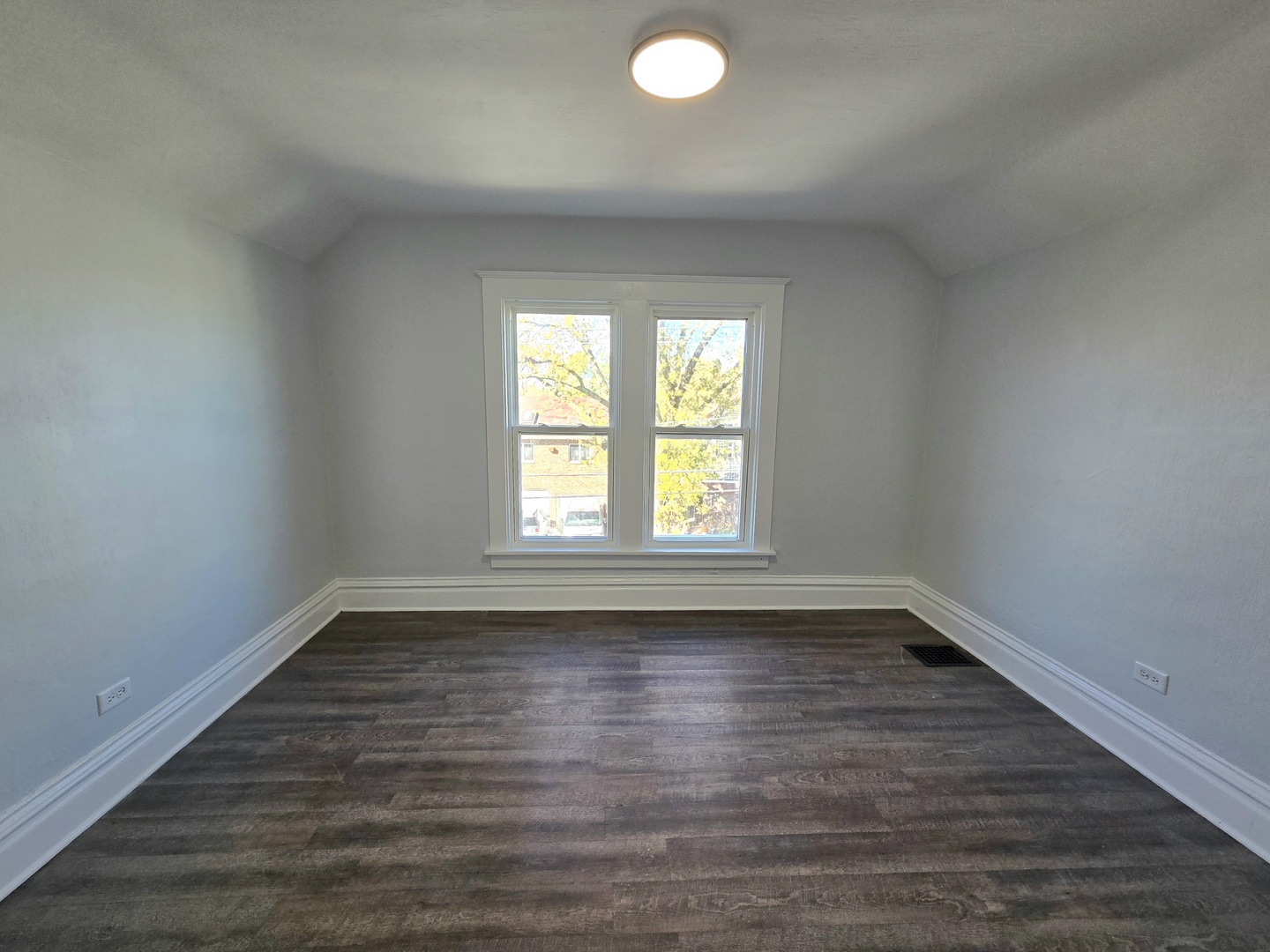 328 Rosewood Avenue Aurora, IL 60505 - Photo 15 of 24 an empty room with wooden floor and windows
